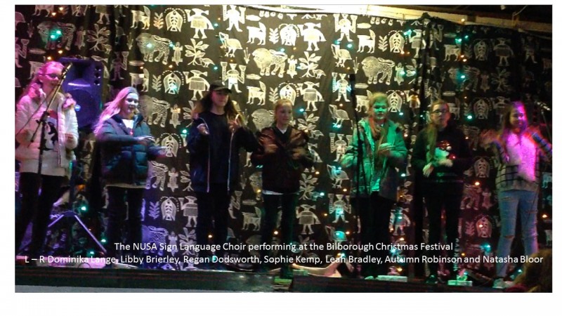 Nusa Signing choir performing at the Bilborough Festival, Bracebridge Drive on the 7th December 2017